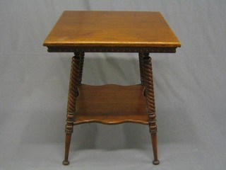 An Edwardian honey oak square 2 tier occasional table raised on spiral turned supports with undertier 24"