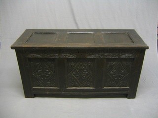 A 17th/18th Century carved oak coffer of panel construction with hinged lid, 51"