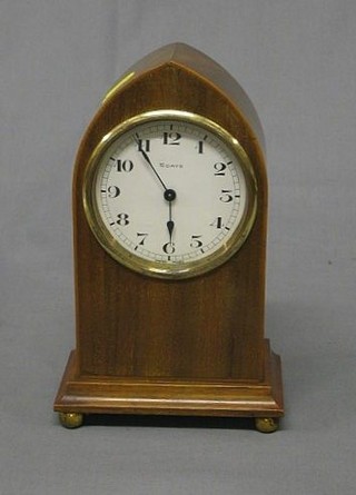A French 8 day bedroom timepiece with enamelled dial and Arabic numerals contained in an arch shaped inlaid mahogany case (slight chip to dial)