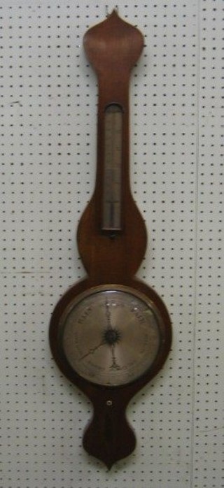 A 19th Century mercury wheel barometer and thermometer with 9" silvered dial contained in a mahogany case