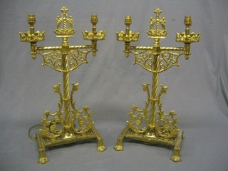 A large pair of pierced brass pugen style twin light table lamps 25"