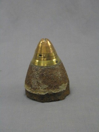 A WWI iron and brass British shell case nose cone, recovered from a French field