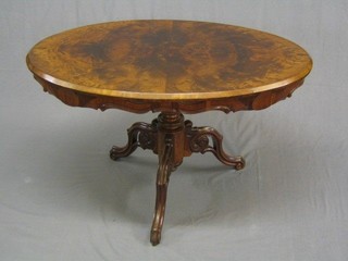 A 19th/20th Century Continental figured walnut oval occasional table, raised on pillar and tripod supports 44"