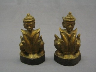 A pair of carved Eastern wooden figures 9"