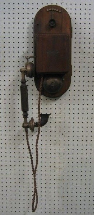 A 19th/20th Century wall mounting internal telephone on an oak plaque