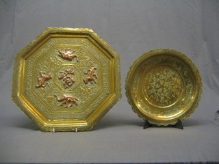 A heavy Eastern brass octagonal shaped charger 16" and a circular ditto 12"