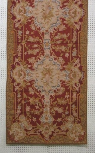 A contemporary Aubusson tapestry panel with floral decoration 72" x 29"