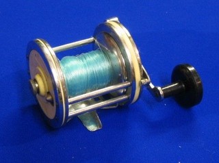 A French white plastic and chromium plated sea fishing reel