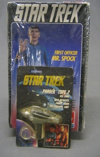 A Star Trek figure of First Officer Mr Spock together with a Star Trek faser type II key ring