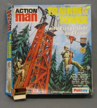 An Action Man training tower with escape slide and crane, boxed