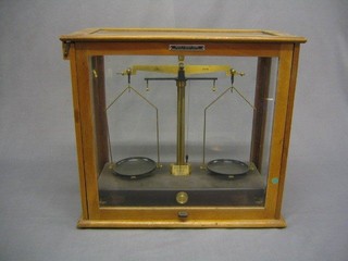 A laboratory scale by Griffin & George ltd contained in a glazed case