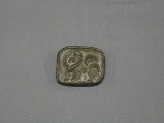 A bronze plaque in the form of a lion 3"