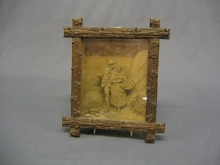 A 19th Century Swiss carved relief panel depicting lady and gentleman walking in mountain area 8" x 6" contained in a Cambridge frame