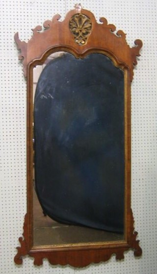 A Queen Anne style shaped plate mirror contained in a mahogany frame 57"
