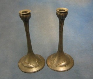 A pair of Art Nouveau Tudric pewter candlesticks, the bases marked DCM/Tudric O335 11"