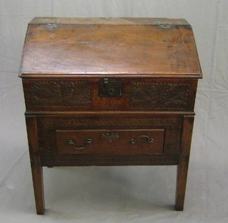 An 18th Century carved oak bible box with hinged lid, the interior fitted 4 drawers with iron lock, the front marked 1792 and raised on a later carved oak base, fitted a drawer 32"