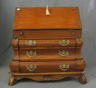 A walnut bureau, the fall front revealing a well fitted interior above 3 long drawers, raised on ball and claw supports 36"