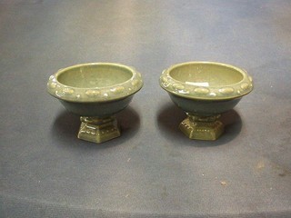 A pair of circular grey glazed Wade pedestal vases 4"