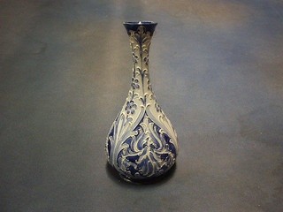 A McIntyre Florianware Iris pattern blue glazed vase, the base marked WM DED, RD no. 326689 Florianware, 8 1/2"