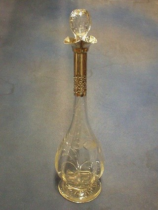 A handsome cut glass decanter and stopper with pierced silver collar