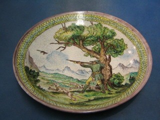 A 19th/20th Century Continental pottery bowl decorated huntsman shooting duck with 2 dogs and mountain landscape to the reverse, the base marked MF SG, 14"