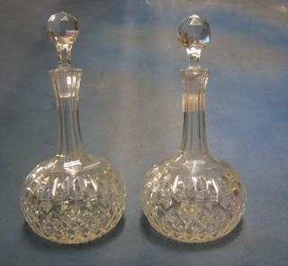 A pair of 19th Century cut glass mallet shaped decanters