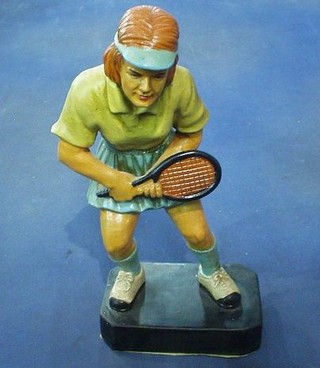 A terracotta figure of a lady tennis player 12"