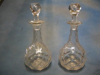 A pair of good quality 19th Century mallet shaped panel cut decanters