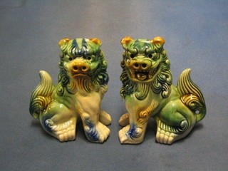 A pair of 20th Century Oriental pottery Dogs of Fo 6"