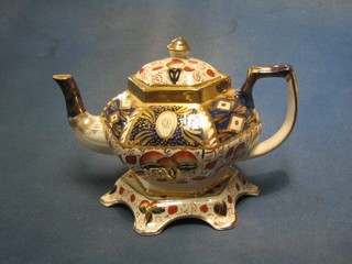 A Derby style 5 piece tea service comprising teapot and 2 stand, sugar bowl and jug