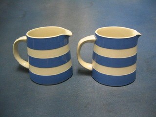 2 T G Greener blue and white striped jugs, the base marked Original Cornish Kitchenware 5"