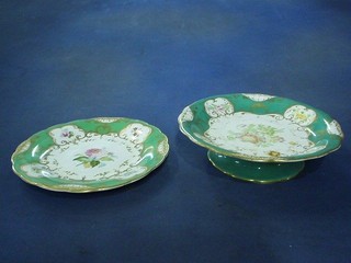 A 19th Century 9 piece green and white porcelain dessert service with green and gilt banding and floral decoration viz: comport and 8 plates