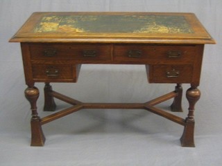 A Victorian aesthetic movement oak writing table with inset tooled leather writing surface, above 2 long and 2 short drawers, raised on bulbous supports with a Y framed stretcher 45"