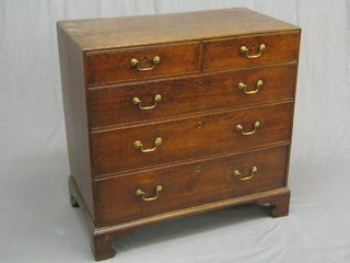 A Georgian Country oak chest of 2 short and 3 long drawers with brass swan neck drop handles, raised on bracket feet 36"