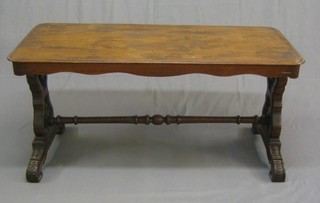 A Victorian rectangular mahogany stretcher table, raised on pierced standard end supports with turned stretcher 54"