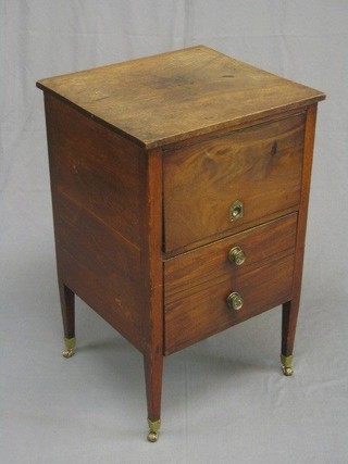 A 19th Century mahogany commode fitted a recess and drawer, raised on square tapering supports ending in brass caps and castors 19"