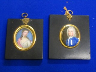 A pair of 19th Century enamelled portrait miniatures on copper "Lady and Gentleman" 2 1/2" oval, contained in ebony frames