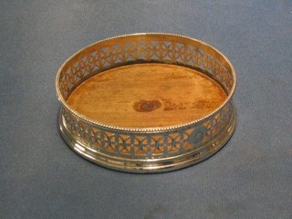 A circular pierced George III silver bottle coaster with armorial decoration London 1818, 5"