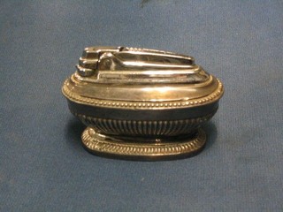 A Ronson Queen Anne style silver plated table lighter with demi-reeded decoration