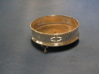 A circular pierced Antique silver bottle coaster, engraved swags with bead work border and wooden base, raised on 3 silver ball and claw feet 5 1/2" (marks rubbed)