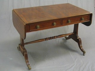 A 19th Century mahogany sofa table fitted 2 frieze drawers and raised on standard end supports ending in splayed feet with acanthus leaf brass caps and castors 39"