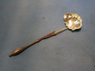 A George III silver punch ladle, London 1765, the base engraved IPN, (2 splits to bowl) with turned wooden handle (f)