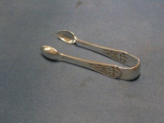 A pair of pierced silver sugar tongs