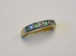 A lady's 18ct gold half eternity ring set 5 emeralds interspaced by diamonds