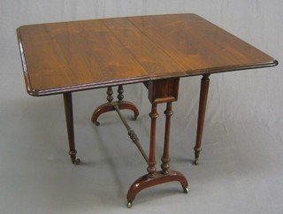 A Victorian rosewood Sutherland table raised on column supports 37"