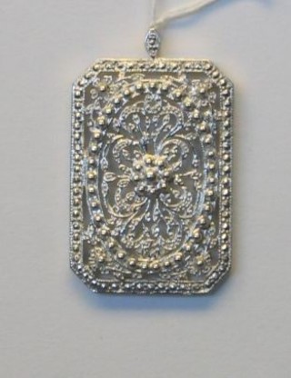 A modern pierced silver pendant