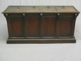 A Victorian carved oak coffer of plank construction with hinged lid, made up of some old timber 59"