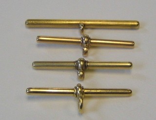 An 18ct gold T bar, a 9ct gold T bar and 2 others