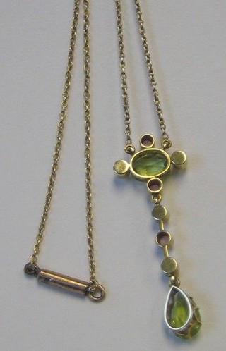 A lady's Edwardian gold chain set 2 peridots, 4 demi-pearls and 3 amethysts
