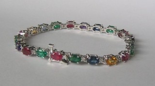 A  lady's 14ct white gold bracelet set rubies, sapphires, emeralds, amethysts etc (set 21 stones)
